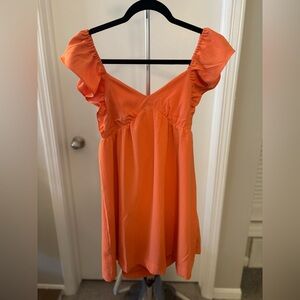 Adorable orange ruffle sleeve dress, new with tags!
